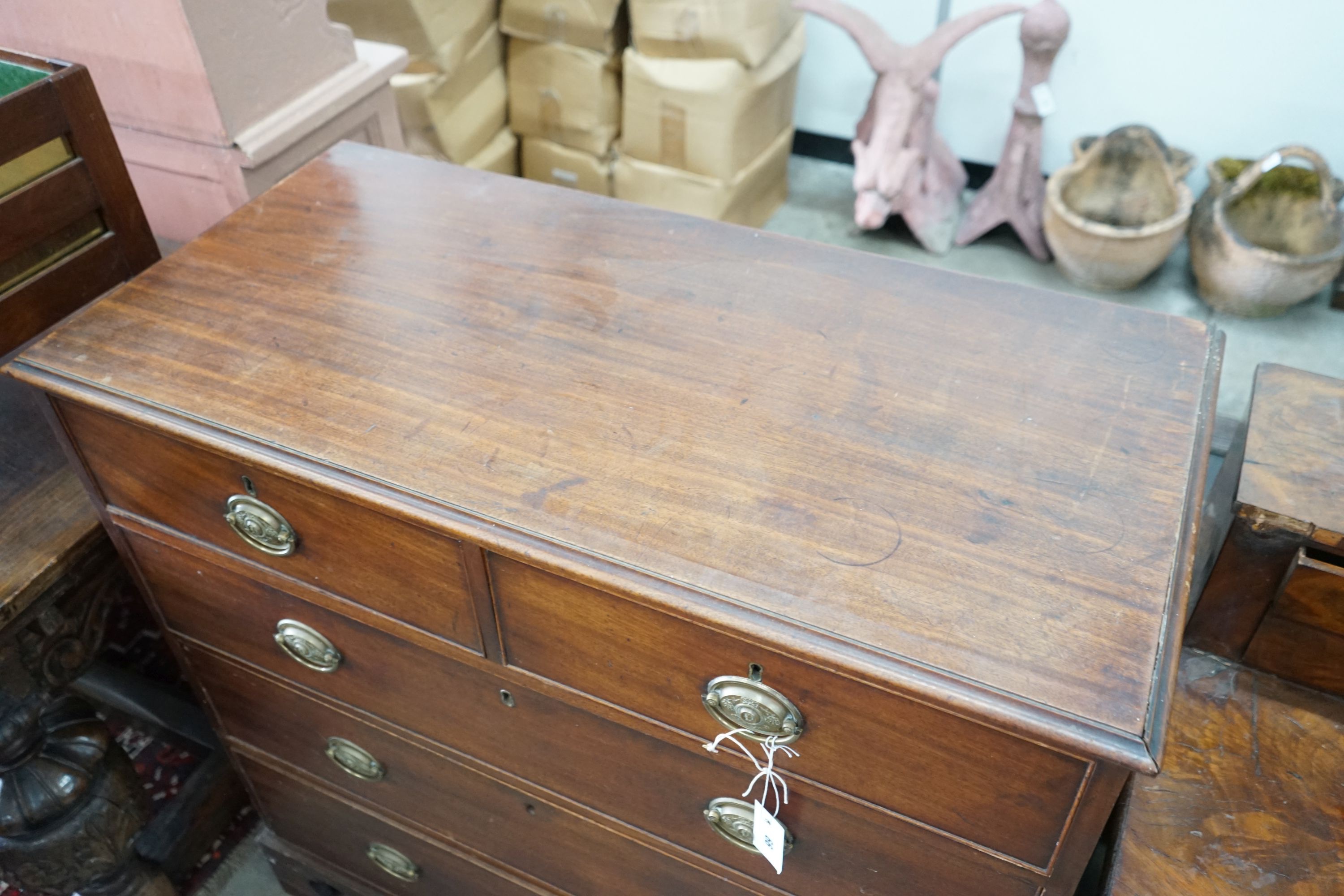 A George III mahogany straight front chest, fitted three long drawers and two short drawers, width 102cm, depth 49cm, height 102cm